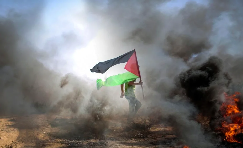 Palestinians in Gaza Bury Remains of 100 Victims